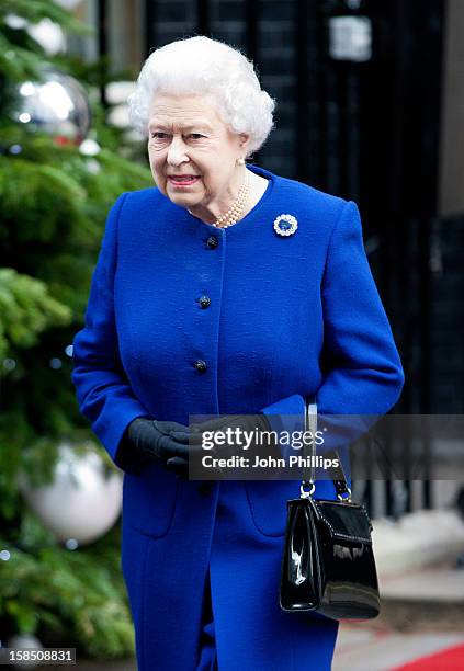 Queen Elizabeth II leaves Number 10 Downing Street after attending the Government's weekly Cabinet meeting on December 18, 2012 in London