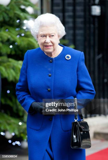 Queen Elizabeth II leaves Number 10 Downing Street after attending the Government's weekly Cabinet meeting on December 18, 2012 in London