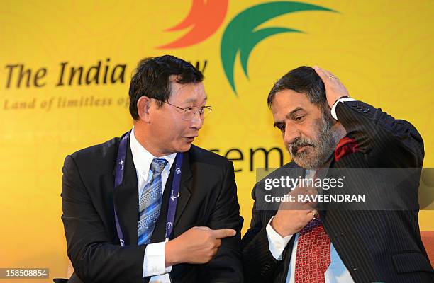 Cambodian Senior Minister and Minister of Commerce Cham Prasidh talks with Indian Minister for Commerce and Industry Anand Sharma during the...