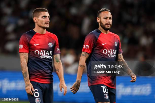 Neymar Jr and Marco Verratti of Paris Saint-Germain walk on the pitch after the preseason friendly match between Paris Saint-Germain and FC...