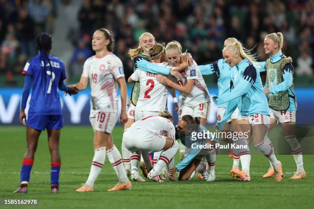 Denmark players celebrate the team's 2-0 victory confirming the team’s qualification for the knockout stage following the FIFA Women's World Cup...