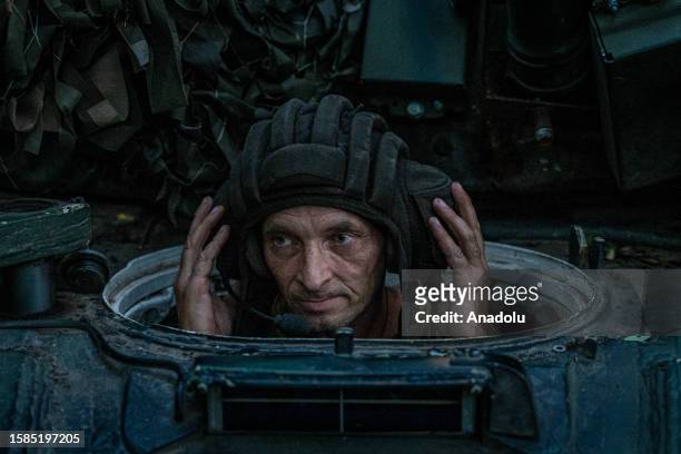 Ukrainian soldiers drive a tank towards the frontline as Ukrainian Army conduct operation to target trenches of Russian forces through the Donetsk...