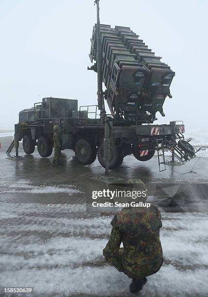 Members of the German Bundeswehr prepare a Patriot missile launching system during a press day presentation at the Luftwaffe Warbelow training center...