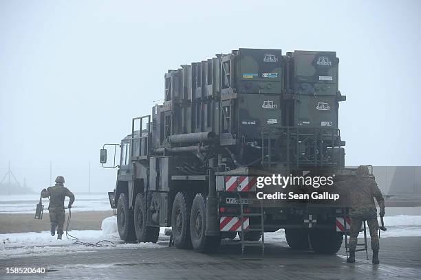 Members of the German Bundeswehr prepare a Patriot missile launching system during a press day presentation at the Luftwaffe Warbelow training center...