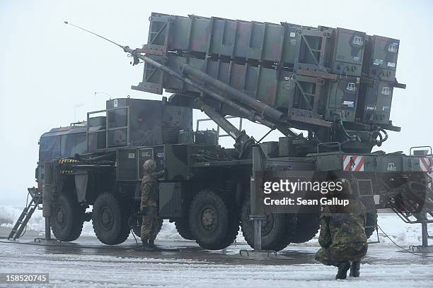 Members of the German Bundeswehr prepare a Patriot missile launching system during a press day presentation at the Luftwaffe Warbelow training center...