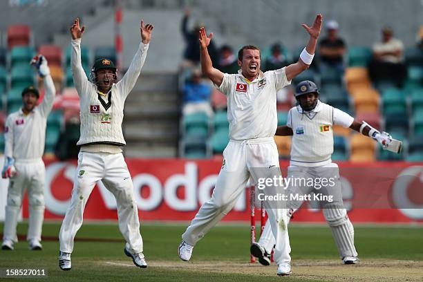 Peter Siddle of Australia appeals successfully for the wicket of Thilan Samaraweera of Sri Lanka during day five of the First Test match between...