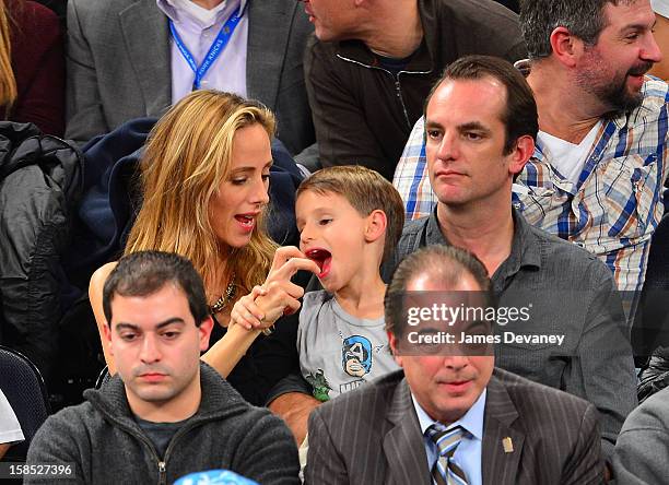 Kim Raver and family attend the Houston Rockets vs New York Knicks game at Madison Square Garden on December 17, 2012 in New York City.