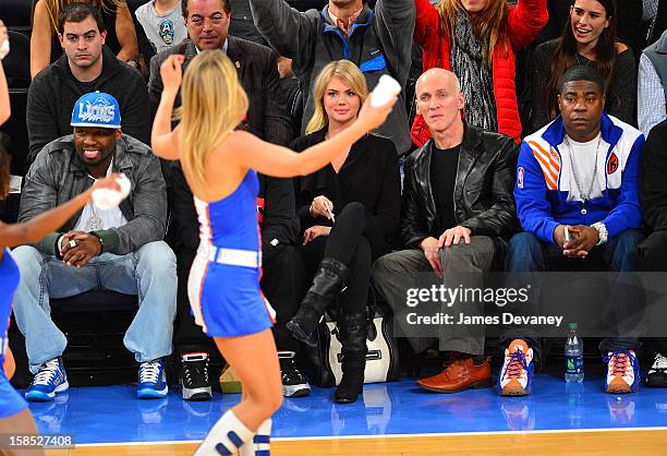 Cent, Kate Upton, guest and Tracy Morgan attend the Houston Rockets vs New York Knicks game at Madison Square Garden on December 17, 2012 in New York...