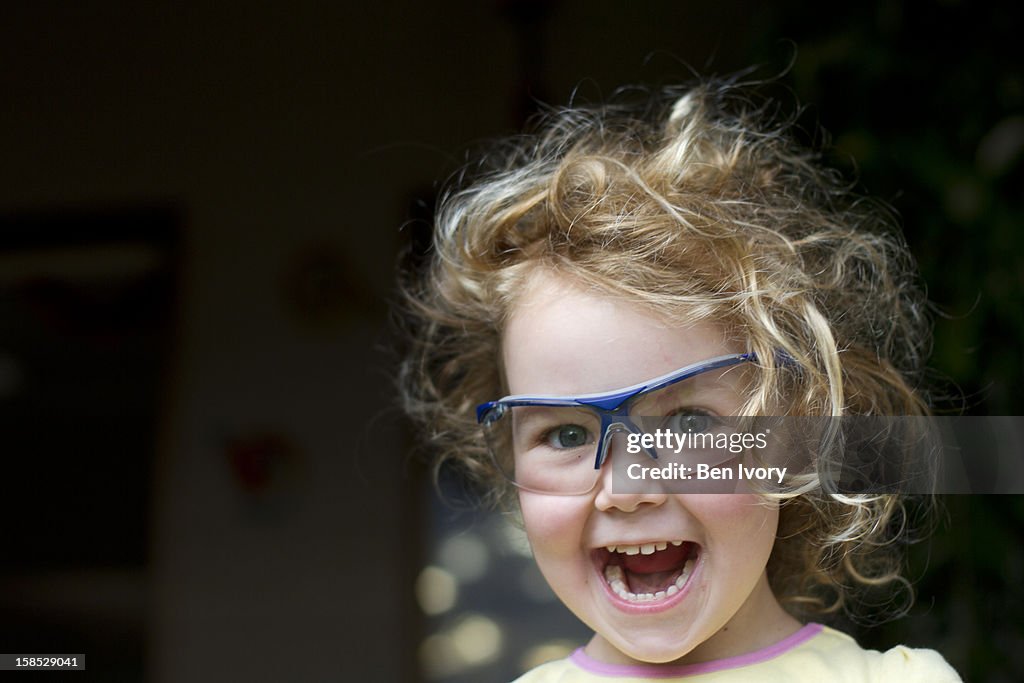 Young girl in safety glasses