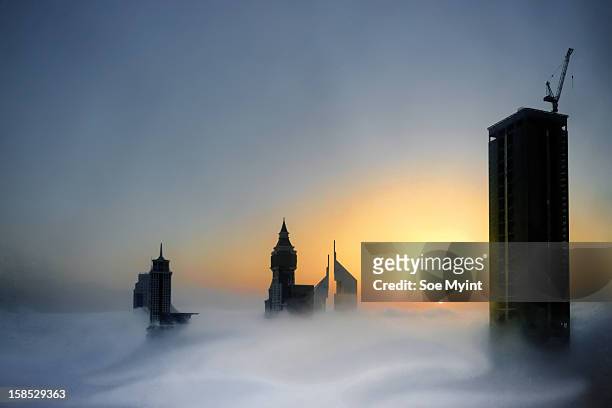 fog and sunrise - soe myint stock-fotos und bilder