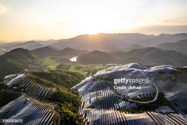 bird's eye view of the solar power plant at sunset - zero emissions stock pictures, royalty-free photos & images