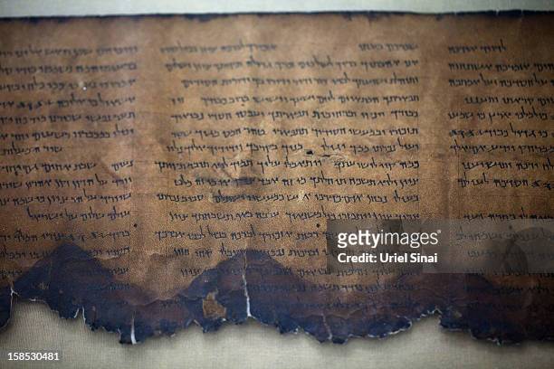 Fragment of the 2000-year-old Dead Sea scrolls is laid out at a laboratory on December 18, 2012 in Jerusalem, Israel. More than sixty years after...