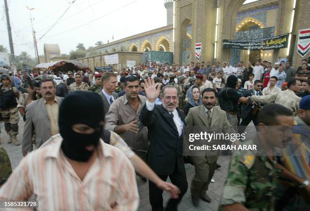 Iraq's National security adviser Muwaffaq al-Rubaei Iraqi waves to the crowd 06 September 2005 as hundreds of Shiite and Sunni Muslims gather at a...