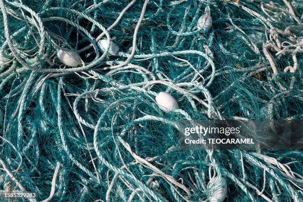 professional fishing nets, bleu, in locquémeau - nets stock pictures, royalty-free photos & images