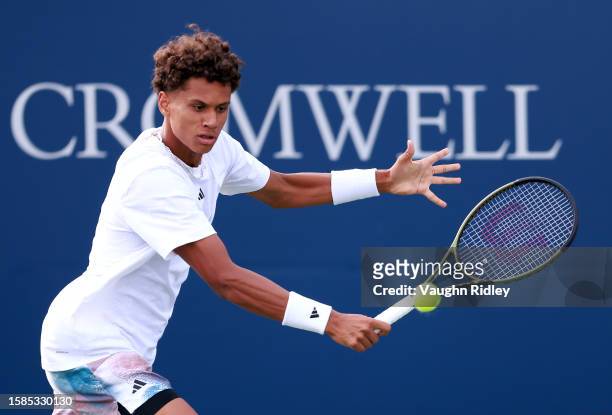 Gabriel Diallo of Canada hits a shot against Daniel Evans of Great Britain during Day Two of the National Bank Open, part of the Hologic ATP Tour, at...