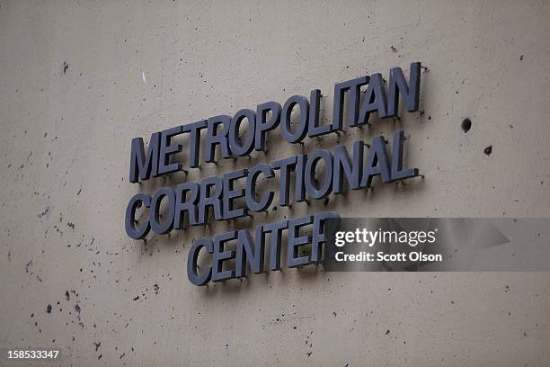 Sign hangs on the side of the federal Metropolitan Correctional Center in the Loop where two convicted bank robbers escaped on December 18, 2012 in...