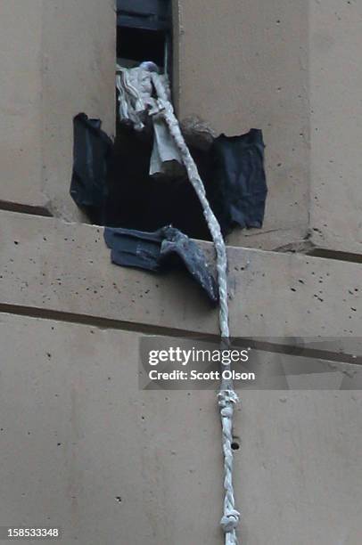 Rope protrudes from a window opening outside the federal Metropolitan Correctional Center in the Loop after two convicted bank robbers escaped on...