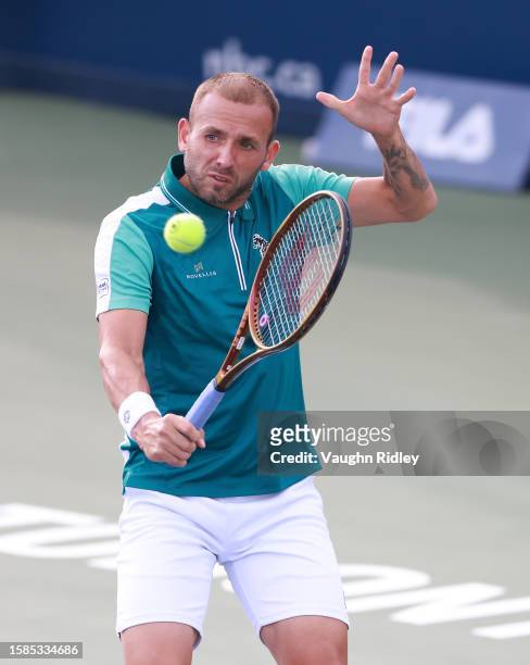 Daniel Evans of Great Britain hits a shot against Gabriel Diallo of Canada during Day Two of the National Bank Open, part of the Hologic ATP Tour, at...