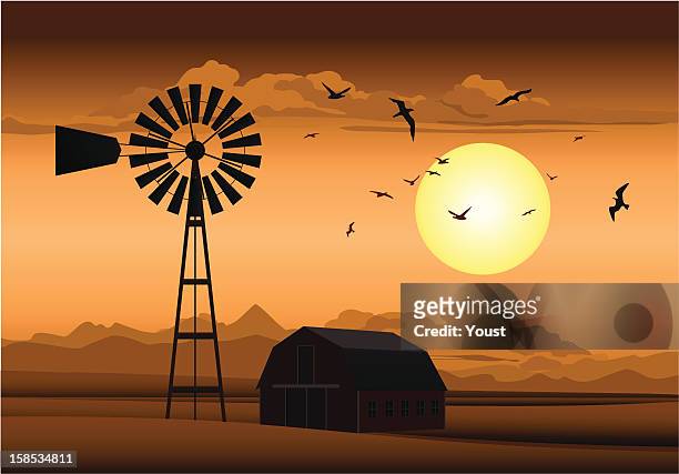 farm at night - windmill stock illustrations