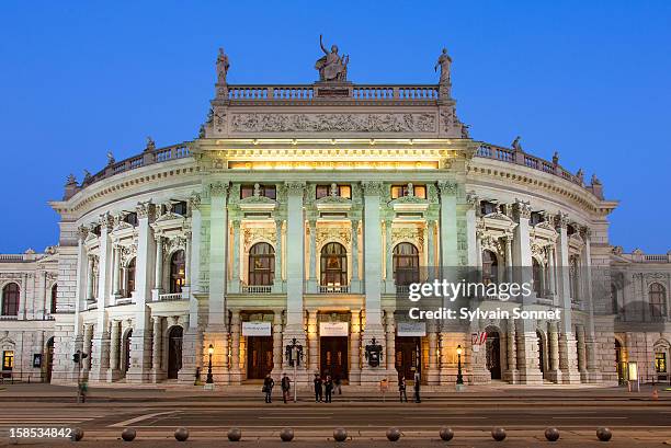 austria, vienna, burgtheater at dusk - burgtheater wien stock pictures, royalty-free photos & images