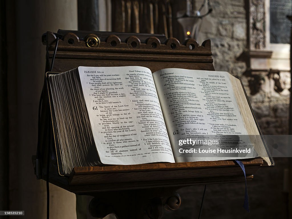 Bible open on a lectern in a church