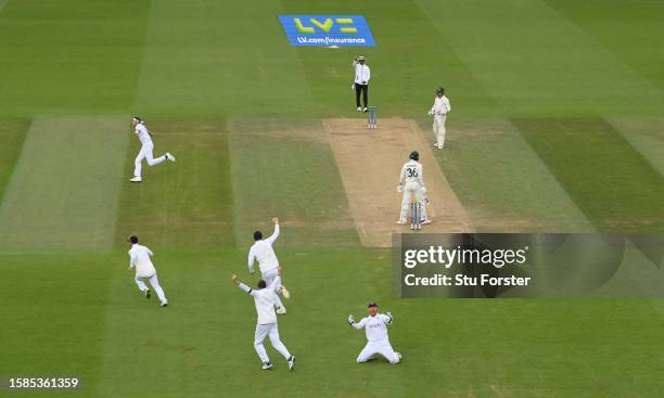 England wicketkeeper Jonny Bairstow celebrates after combining with bowler Stuart Broad to take the wicket of Todd Murphy during day five of the LV=...