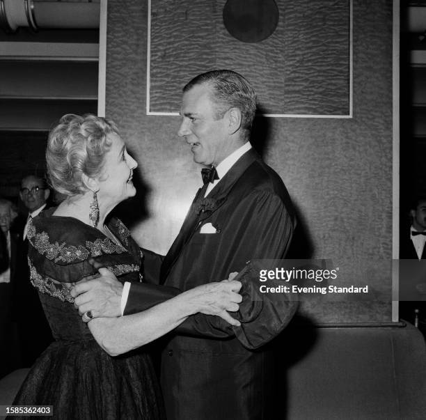 Actress Fay Compton embraces actor Laurence Olivier London, July 22nd 1959. Olivier and Compton were backstage at rehearsals for the 'Night of 100...