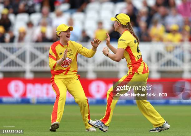 Alexa Stonehouse celebrates with Kirstie Gordon of Trent Rockets after taking the catch to dismiss Maia Bouchier of Southern brave during The Hundred...