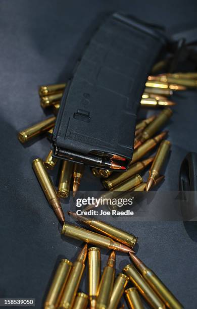 In this photo illustration, a magazine for a AR-15 rifle is seen with ammunition on December 18, 2012 in Miami, Florida. The AR-15 rifle was used...