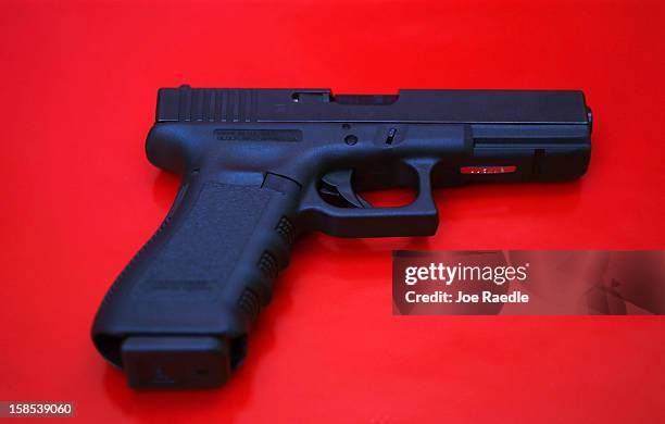 In this photo illustration a Glock pistol is seen on December 18, 2012 in Miami, Florida. The weapon is the same type that was used during a massacre...