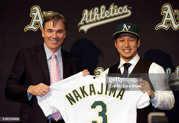 Oakland Athletics vice president and general manager Billy Beane introduces Hiroyuki Nakajima of Japan to the Oakland Athletics at the O.co Coliseum...