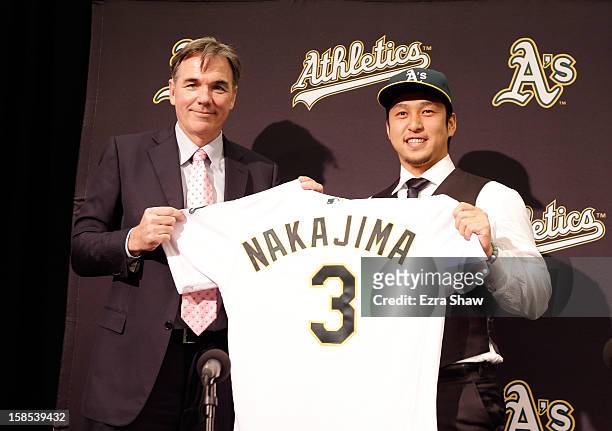 Oakland Athletics vice president and general manager Billy Beane introduces Hiroyuki Nakajima of Japan to the Oakland Athletics at the O.co Coliseum...