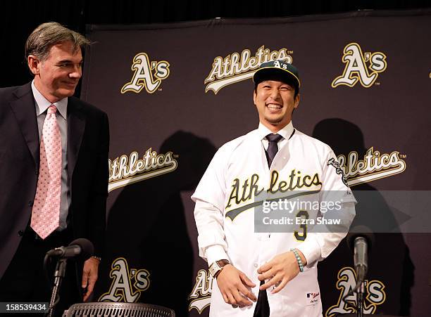 Oakland Athletics vice president and general manager Billy Beane introduces Hiroyuki Nakajima of Japan to the Oakland Athletics at the O.co Coliseum...