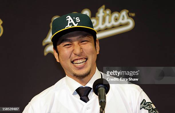 Hiroyuki Nakajima of Japan speaks at a press conference where he was introduced by the Oakland Athletics at the O.co Coliseum on December 18, 2012 in...