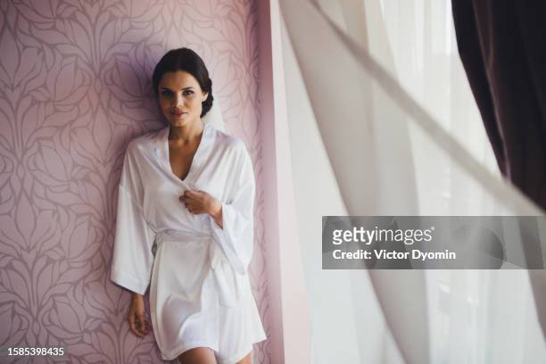 beautiful young bride in the morning gown - evening gown stockfoto's en -beelden