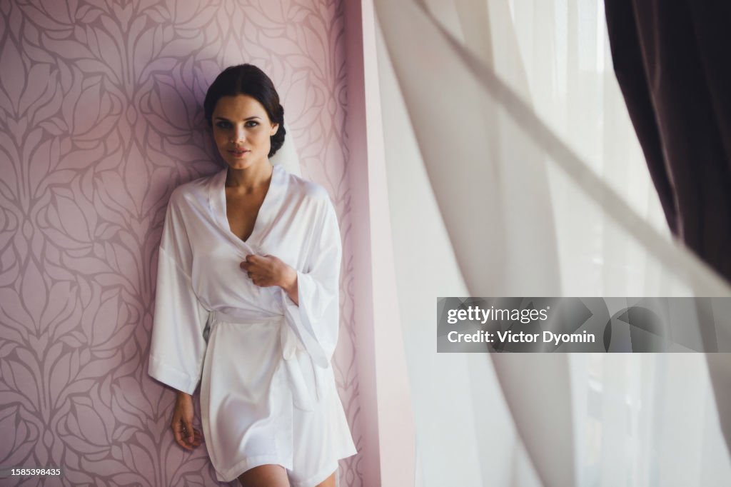 Beautiful young bride in the morning gown