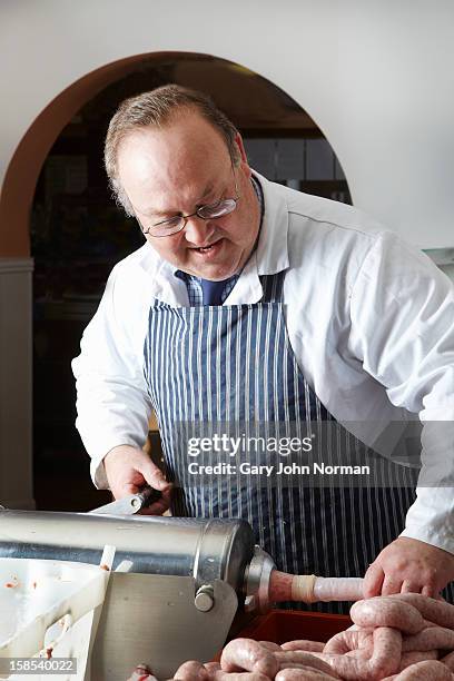 english butcher making sausages - butcher stock pictures, royalty-free photos & images