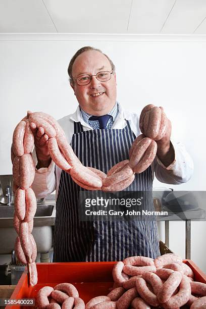 english butcher with sausages - macellaio foto e immagini stock