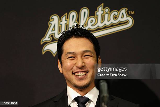 Hiroyuki Nakajima of Japan speaks at a press conference where he was introduced by the Oakland Athletics at the O.co Coliseum on December 18, 2012 in...