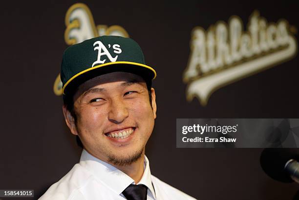 Hiroyuki Nakajima of Japan speaks at a press conference where he was introduced by the Oakland Athletics at the O.co Coliseum on December 18, 2012 in...