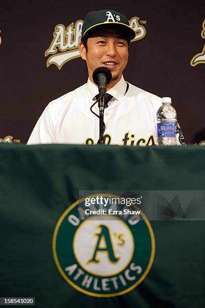 Hiroyuki Nakajima of Japan speaks at a press conference where he was introduced by the Oakland Athletics at the O.co Coliseum on December 18, 2012 in...