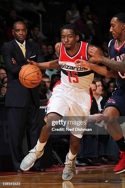 Jordan Crawford of the Washington Wizards drives against Jeff Teague of the Atlanta Hawks during the game at the Verizon Center on December 18, 2012...