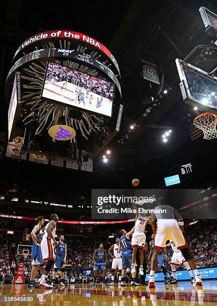 Shane Battier of the Miami Heat wins a jump ball over Jose Juan Barea of the Minnesota Timberwolves during a game at American Airlines Arena on...