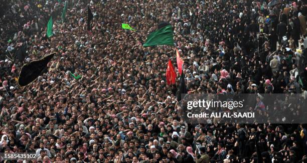 Hundreds of thousands of Shiite pilgrims beat their chests during the Ashura procession outside Imam Hussein's Shrine in the holy city of Karbala, 30...