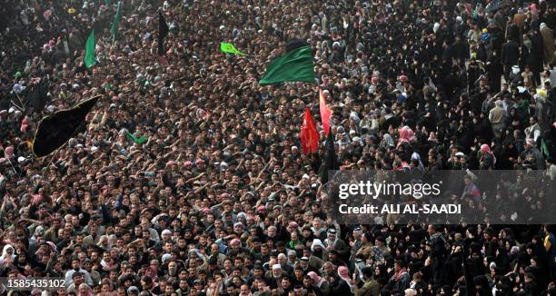 Hundreds of thousands of Shiite pilgrims beat their chests during the Ashura procession outside Imam Hussein's Shrine in the holy city of Karbala, 30...