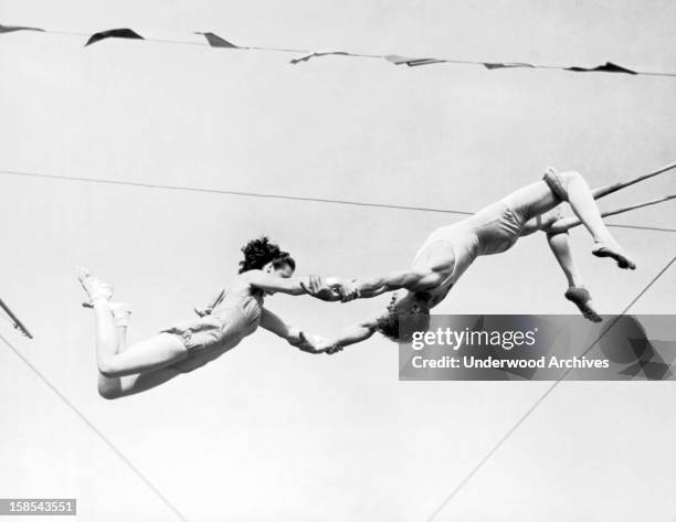 Two aerial artists for the Ringling Brothers and Barnum and Bailey Circus start limbering up for the summer circuit, Sarasota, Florida, March 13,...