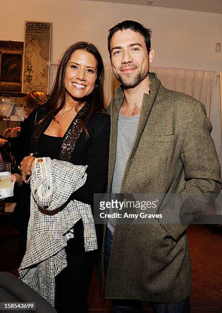 Adam Rayner and guest attend Lorien Haynes' Art Show at The Quest on December 14, 2012 in Los Angeles, California.