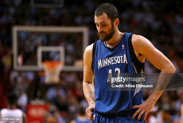 Kevin Love of the Minnesota Timberwolves looks on during a game against the Miami Heat at American Airlines Arena on December 18, 2012 in Miami,...