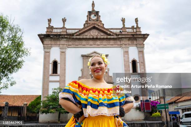 portrait of a folkloric dancer in traditional jalisco dress. - traditional music stock pictures, royalty-free photos & images