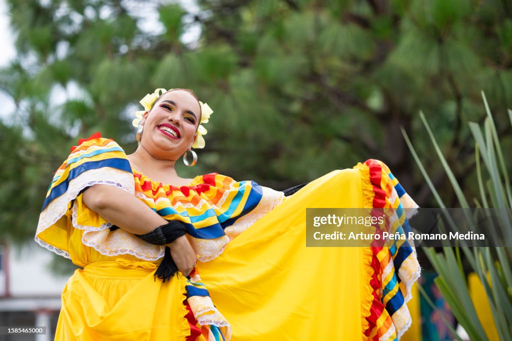 Portrait of dancer enjoying her dance in traditional Jalsico costume